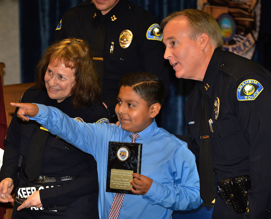 Enrique Mendez receives an award for Outstanding Achievement and Exemplary Behavior during the Do the Right Thing awards ceremony at the Anaheim police headquarters. Photo by Steven Georges/Behind the Badge OC