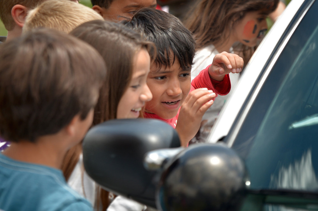Kids at Rolling Hills Elementary crowd around a Fullerton police car during the Team Kids Challenge Carnival benefiting cystic fibrosis research and education. Photo by Steven Georges/Behind the Badge OC