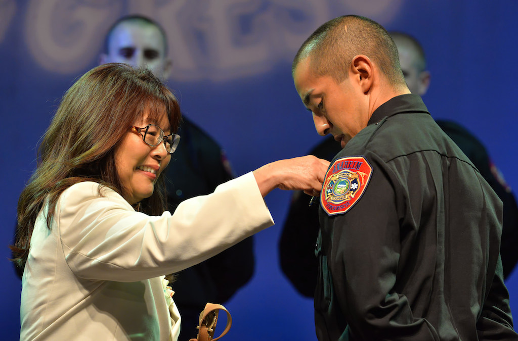 David Loya receives his badge from his mother Frances Loya. Photo by Steven Georges/Behind the Badge OC