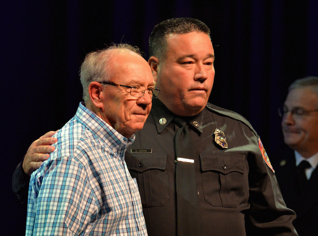 Captain Dan Lecon with his father Dan Lecon, a retired US Air Force master sergeant, after receiving his new badge during the Anaheim Fire & Rescue Promotion and Graduation ceremony. Photo by Steven Georges/Behind the Badge OC