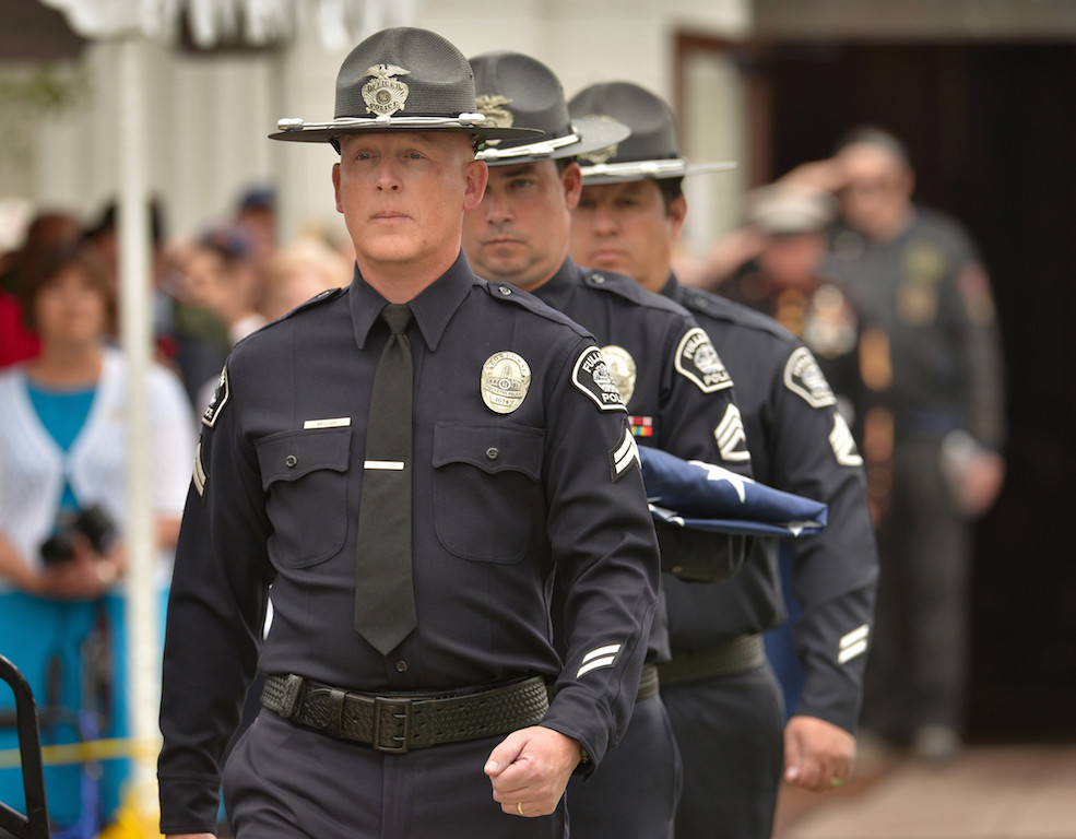 Cpl. Scott Moore, left, Sgt. Tony Bogart and Sgt. Dan Castillo of the Fullerton Police Officer Color Guard enter the grounds during the Presentation of Colors for the 77th Annual Memorial Day Ceremony at Loma Vista Memorial Park in Fullerton. Photo by Steven Georges/Behind the Badge OC