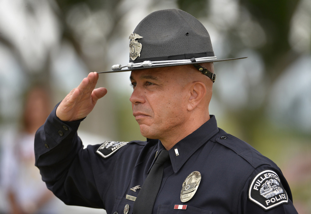 Lt. Alex Bastreri of the Fullerton Police Officer Color Guard salutes during the Presentation of Service Flags for the 77th Annual Memorial Day Ceremony at Loma Vista Memorial Park in Fullerton. Photo by Steven Georges/Behind the Badge OC