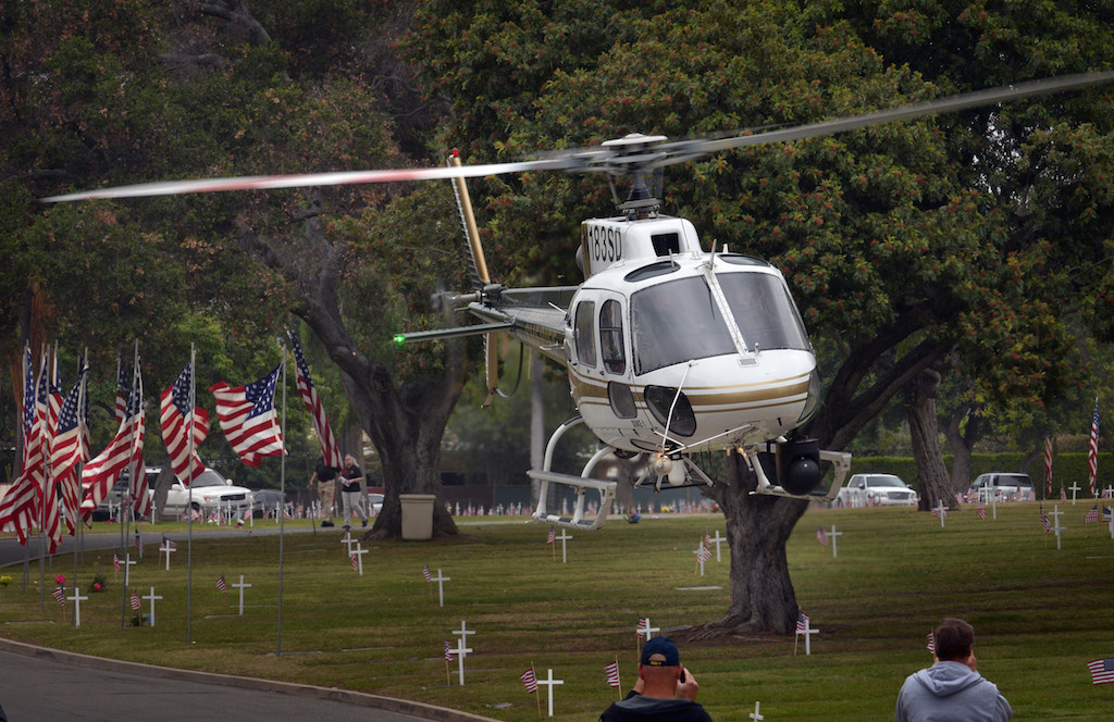 An Orange County Sherif helicopter lands at Loma Vista Memorial Park in Fullerton carrying honored guest to the 77th Annual Memorial Day Ceremony. Photo by Steven Georges/Behind the Badge OC