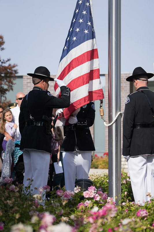 The Westminster Police Department Honor Guard raises the American flag to half-mast at the annual memorial ceremony outside the police department. Photo by Jim Banks/Behind the Badge OC. 