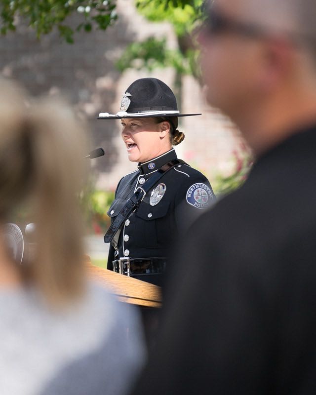 Westminster Officer Rachel Proulx sings the National Anthem at the annual memorial ceremony to remember fallen officers. 