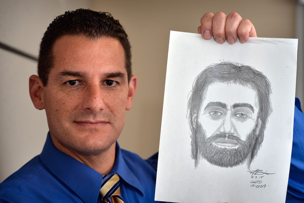 Garden Grove Police Det. Ed DesBiens holds up a sketch of a suspect the agency is still trying to identify. The man attacked a couple in their apartment complex parking lot near Chapman Avenue and Bayport Street on Jan. 19, 2015. Photo by Steven Georges/Behind the Badge OC