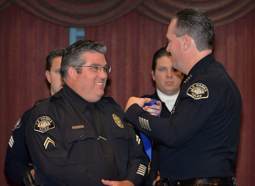 Cpl. Paul McPhillips receives a Career Service Medal for 20 years of Service from La Habra Police Chief Jerry Price during the La Habra Police Department Awards & Commendations Ceremony. Photo by Steven Georges/Behind the Badge OC
