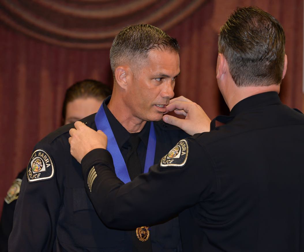 Animal Control Officer Ian Daugherty receives a Career Service Medal for 20 years of Service from La Habra Police Chief Jerry Price during the La Habra Police Department Awards & Commendations Ceremony. Photo by Steven Georges/Behind the Badge OC