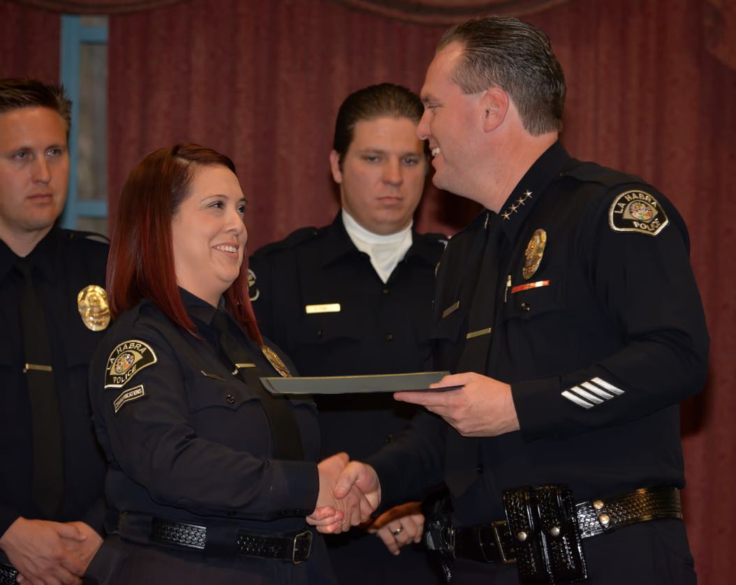 Communications Operator Christina Argott receives the Chief’s Citation from La Habra Police Chief Jerry Price during the La Habra Police Department Awards & Commendations Ceremony. Photo by Steven Georges/Behind the Badge OC