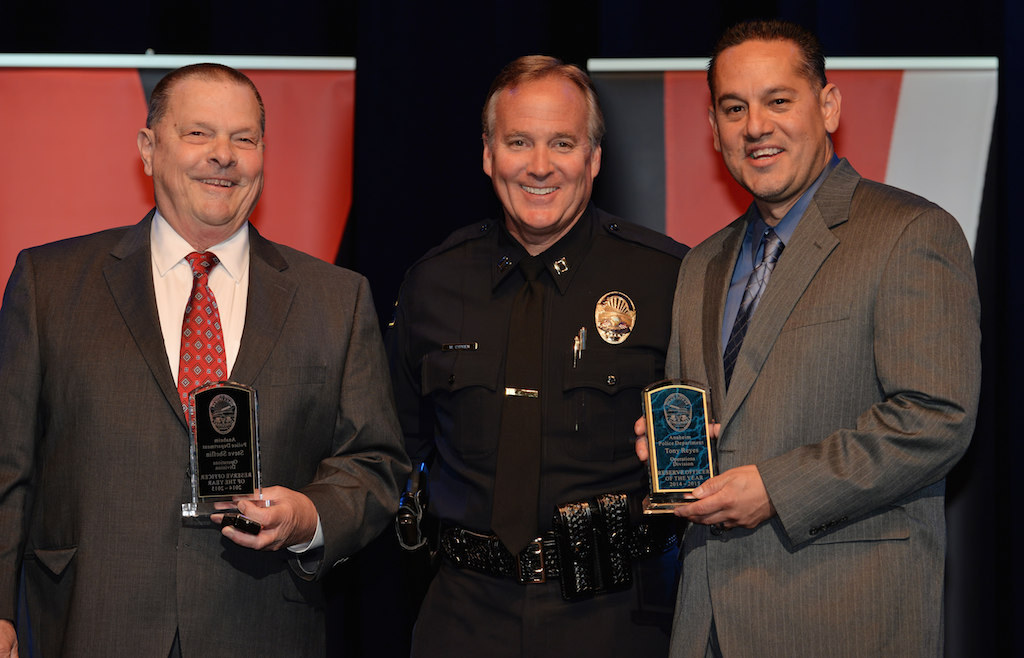 Steve Sheflin, left, and Antonio Reyes, right, receive the Reserve Officer of the Year awards from Lt. Mark Cyprien during Anaheim PD’s 2015 Awards and Retirement Ceremony. Photo by Steven Georges/Behind the Badge OC