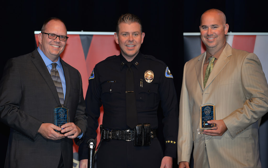 Jacques Laffoon, left, and Mathew Beck, right, receive the Operations Support Division Officer of the Year award from Lt. Jaret Young during Anaheim PD’s 2015 Awards and Retirement Ceremony. Photo by Steven Georges/Behind the Badge OC