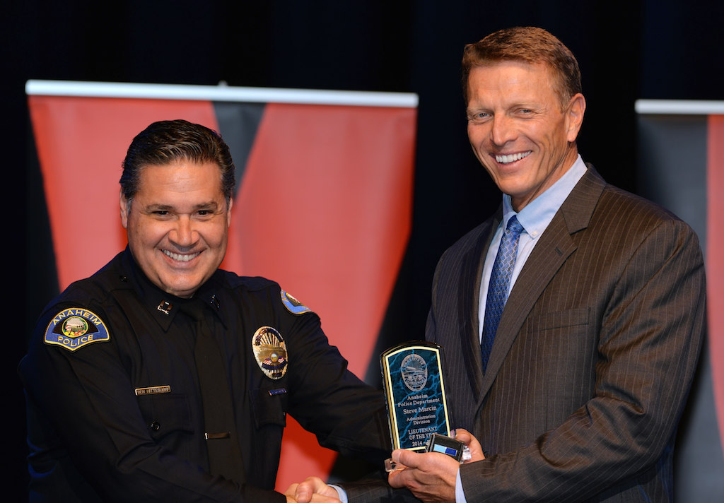 Steve Marcin, right, receives the Administration Division Lieutenant of the Year award from Lt. Ben Hittesdorf during Anaheim PD’s 2015 Awards and Retirement Ceremony. Photo by Steven Georges/Behind the Badge OC