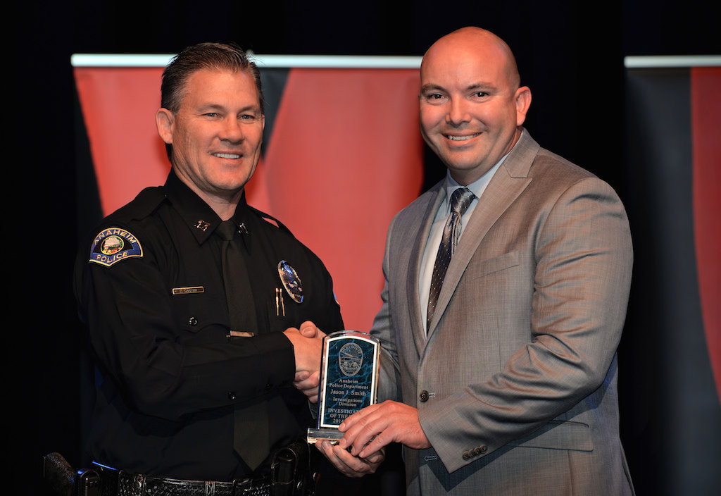 Jason Smith, right, receives the Investigations Division Investigator of the Year award from Lt. Eric Carter during Anaheim PD’s 2015 Awards and Retirement Ceremony. Photo by Steven Georges/Behind the Badge OC
