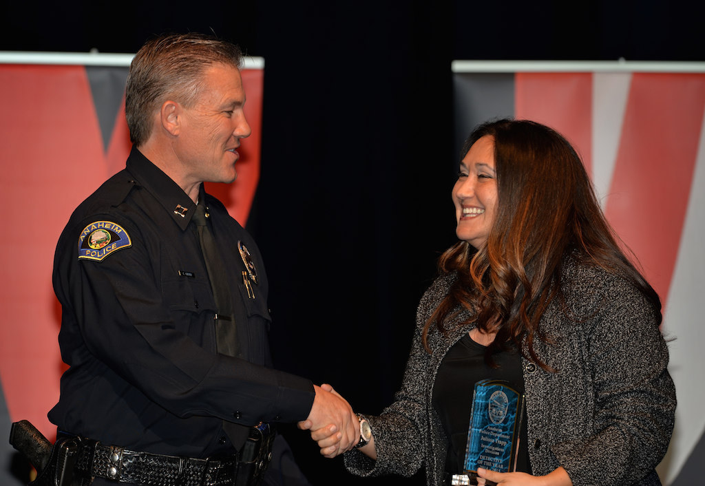 Julissa Trapp, right, receives the Investigations Division Detective of the Year award from Lt. Eric Carter during Anaheim PD’s 2015 Awards and Retirement Ceremony. Photo by Steven Georges/Behind the Badge OC