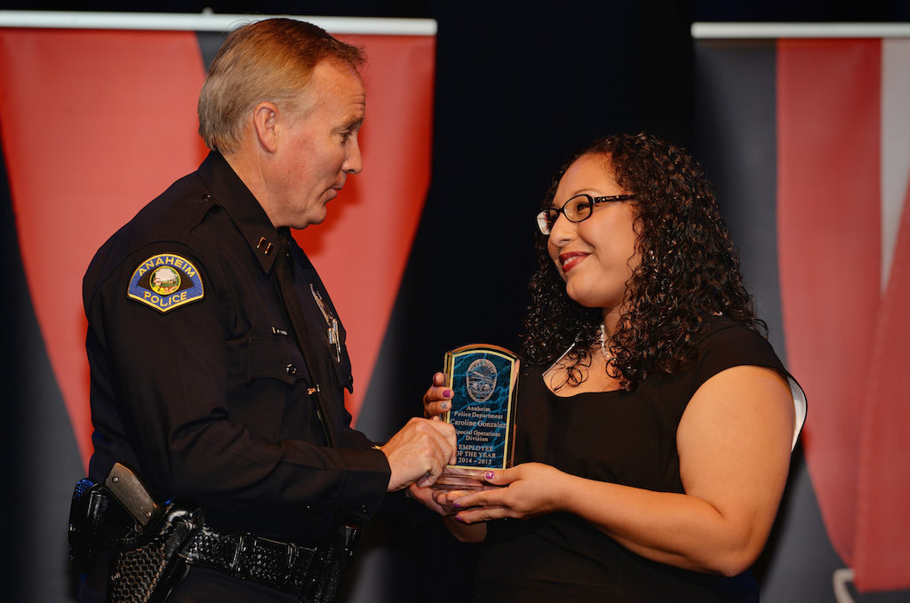 Caroline Gonzalez, right, receives the Special Operations Division Employee of the Year award from Lt. Mark Cyprien during Anaheim PD’s 2015 Awards and Retirement Ceremony. Photo by Steven Georges/Behind the Badge OC