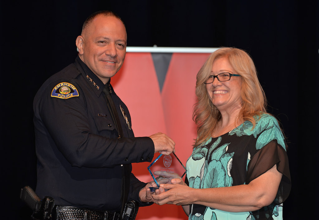 Anaheim Police Chief Raul Quezada presents Lynn Fulton of Coast to Coast Foundation a Special Appreciation Award. Photo by Steven Georges/Behind the Badge OC
