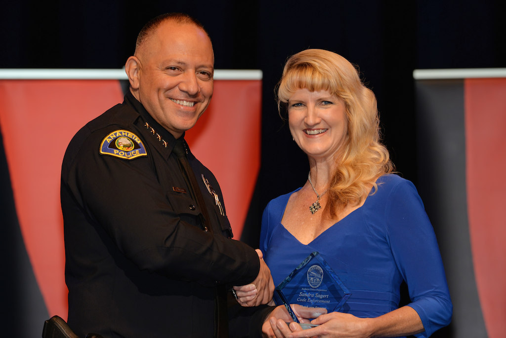 Anaheim Police Chief Raul Quezada presents Sandrea Sagert of Anaheim Code Enforcement a Special Appreciation Award during Anaheim PD’s 2015 Awards and Retirement Ceremony. Photo by Steven Georges/Behind the Badge OC