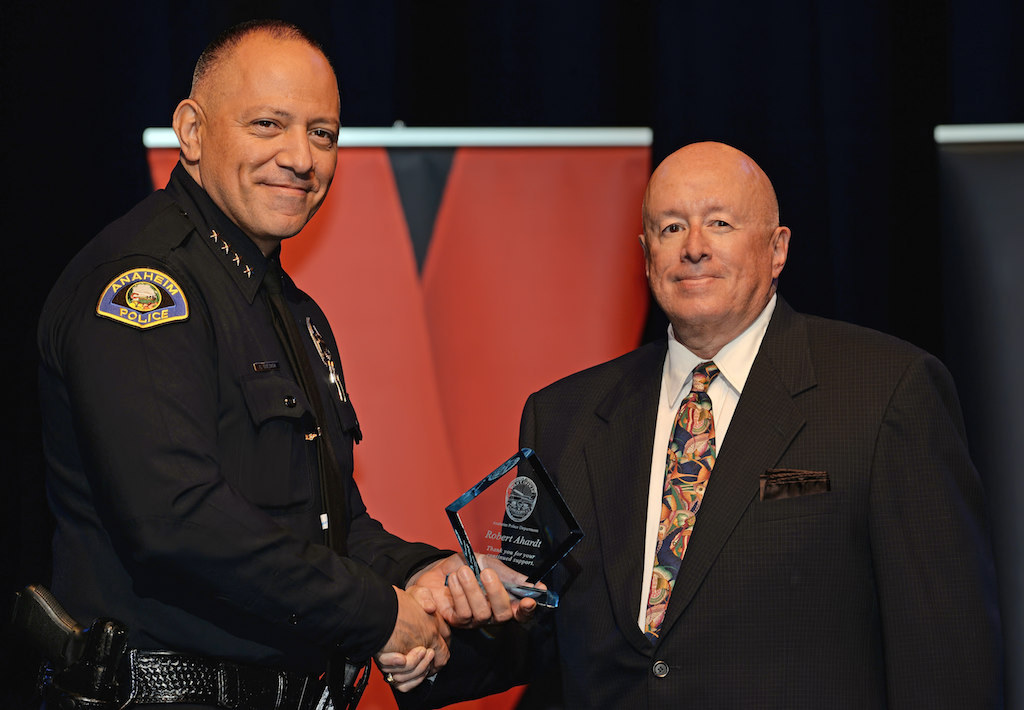 Anaheim Police Chief Raul Quezada presents the Community Member Recognition award to Robert Ahardt. Photo by Steven Georges/Behind the Badge OC