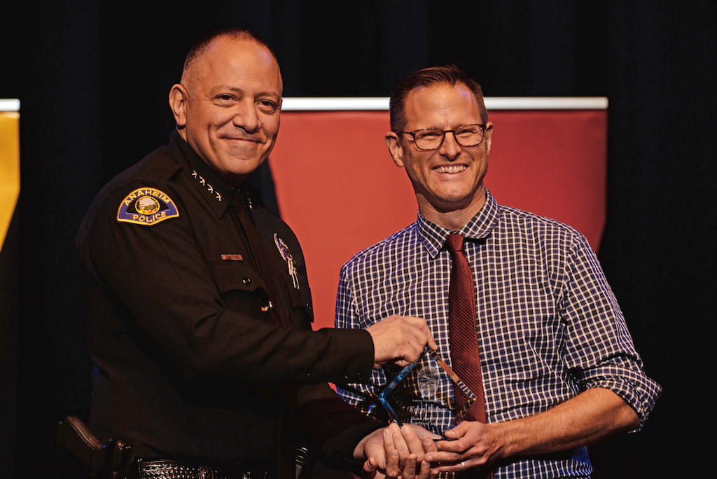 Anaheim Police Chief Raul Quezada presents the Community Member Recognition award to Kevin Kidney. Photo by Steven Georges/Behind the Badge OC