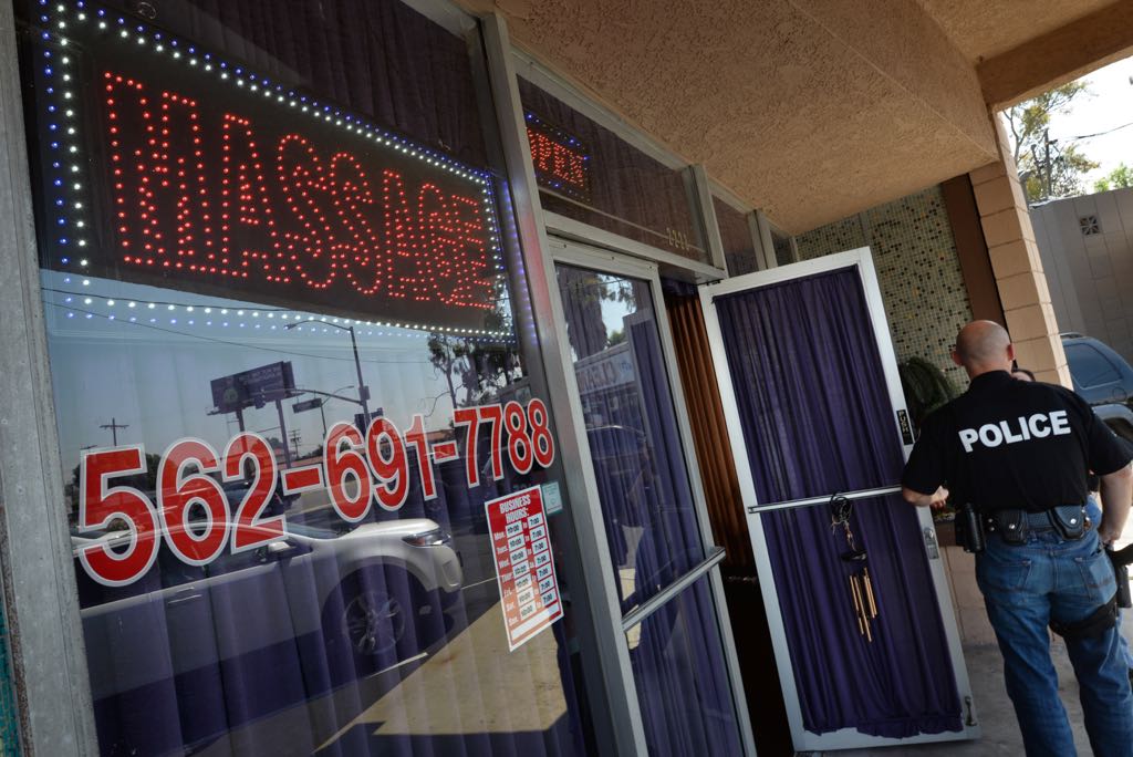 Heavily draped windows and neon signs like these often alert officers to a potential illicit massage business. La Habra Police on Friday, May 29, ran a sting operation to target the illegal businesses. Photo by Steven Georges/Behind the Badge OC