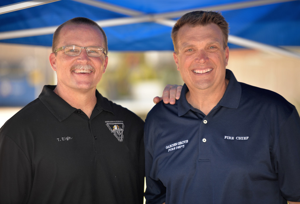 Garden Grove Police Chief Todd Elgin, left, and the new Garden Grove Fire Chief, Tom Schultz, were on hand to meet with local residents (and cook hot dogs) during a neighborhood cleanup. Photo by Steven Georges/Behind the Badge OC