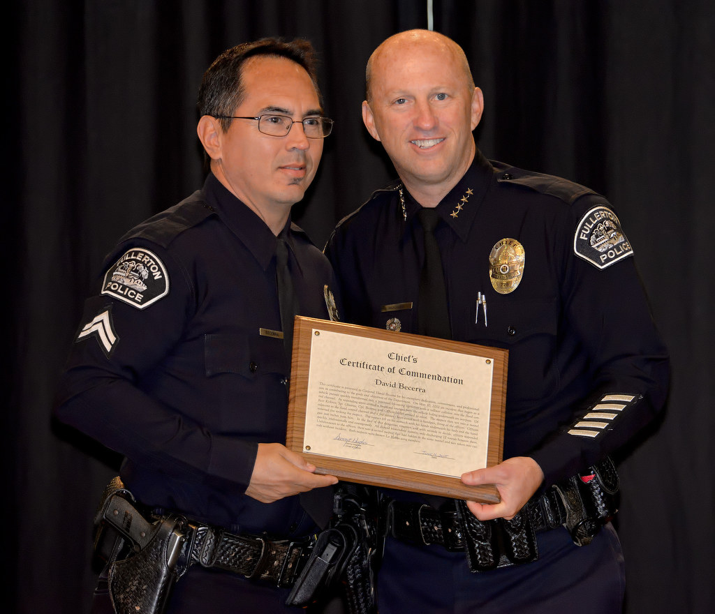 Cpl. David Becerra receives the Chief’s Certificate of Commendation during Fullerton PD’s Promotions and Awards Ceremony, for an incident dealing with gang members under fire. Photo by Steven Georges/Behind the Badge OC