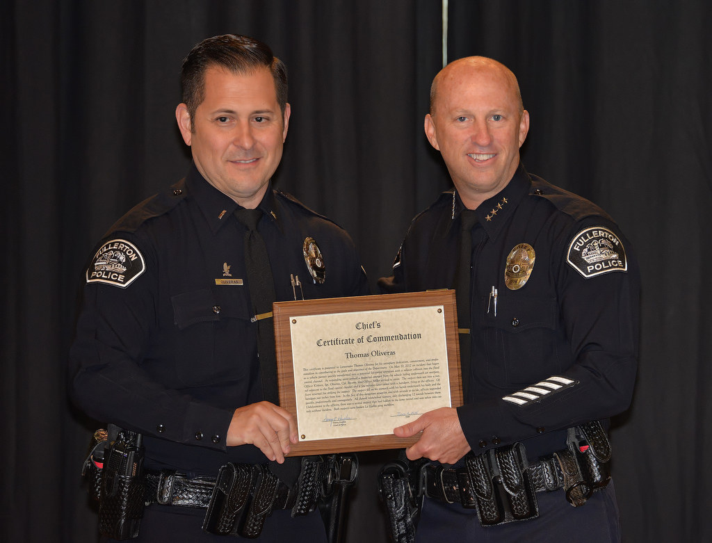 Lt. Thomas Oliveras receives the Chief’s Certificate of Commendation during Fullerton PD’s Promotions and Awards Ceremony, for an incident dealing with gang members under fire. Photo by Steven Georges/Behind the Badge OC