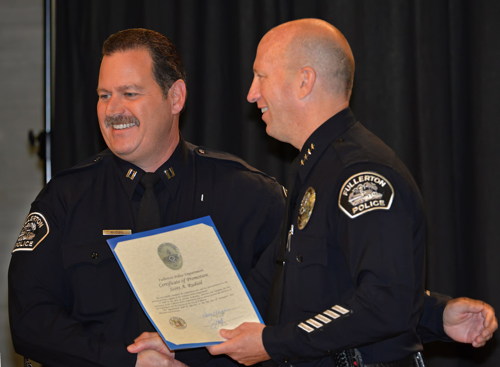 Scott Rudisil receives his promotion certificate and badge for the rank of Captain from Chief Dan Hughes during Fullerton PD’s Promotions and Awards Ceremony. Photo by Steven Georges/Behind the Badge OC