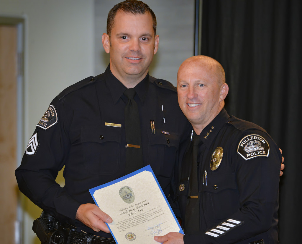 John Ema receives his promotion certificate for the rank of Sergeant from Chief Dan Hughes during Fullerton PD’s Promotions and Awards Ceremony. Photo by Steven Georges/Behind the Badge OC