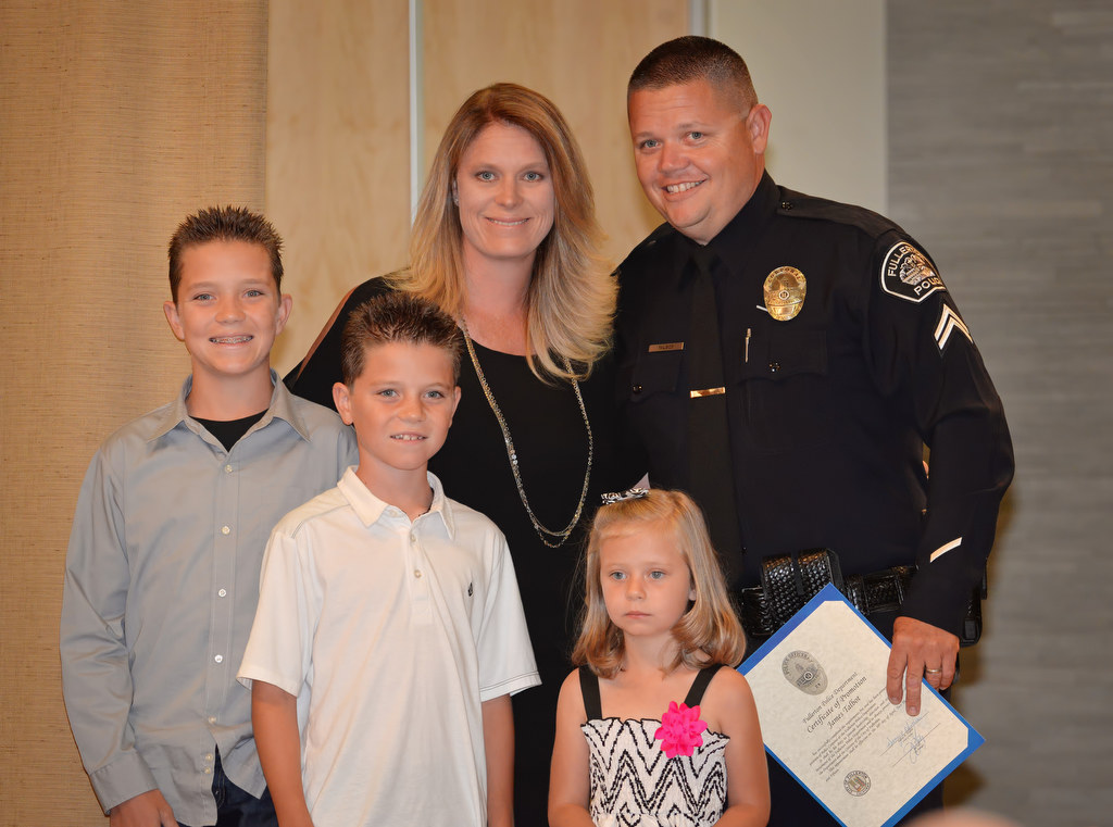 James Talbot stands with his wife Erin and kids Tyler, Tanner and Lexie after receiving his new Corporal badge during Fullerton PD’s Promotions and Awards Ceremony. Photo by Steven Georges/Behind the Badge OC