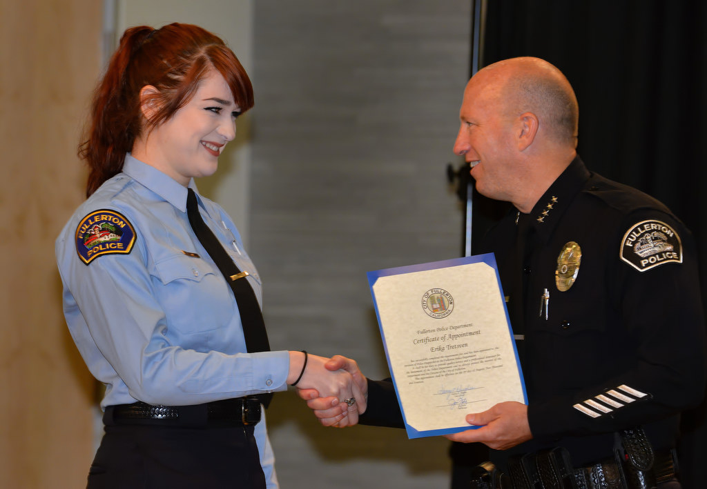 Erika Tretsven, receives her certificate of appointment for the position of Police Dispatcher from Chief Dan Hughes during Fullerton PD’s Promotions and Awards Ceremony. Photo by Steven Georges/Behind the Badge OC