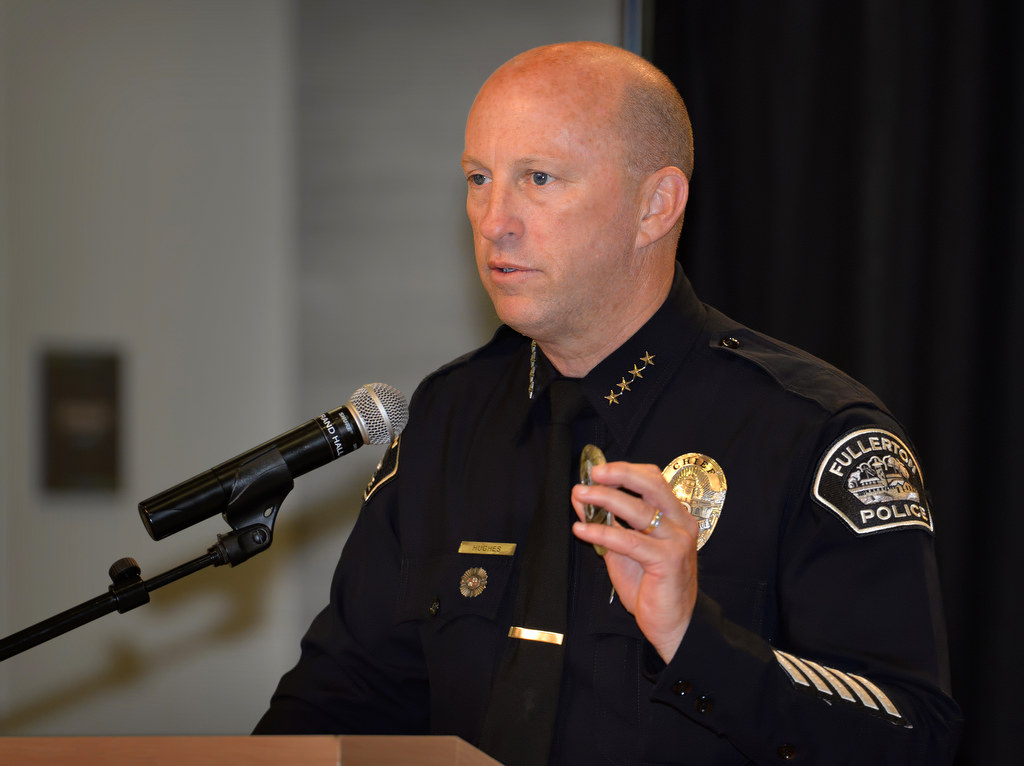 Fullerton Police Chief Dan Hughes talks about the honor of the badge to those gathered for Fullerton PD’s Promotions and Awards Ceremony at the Fullerton Community Center Grand Hall. Photo by Steven Georges/Behind the Badge OC