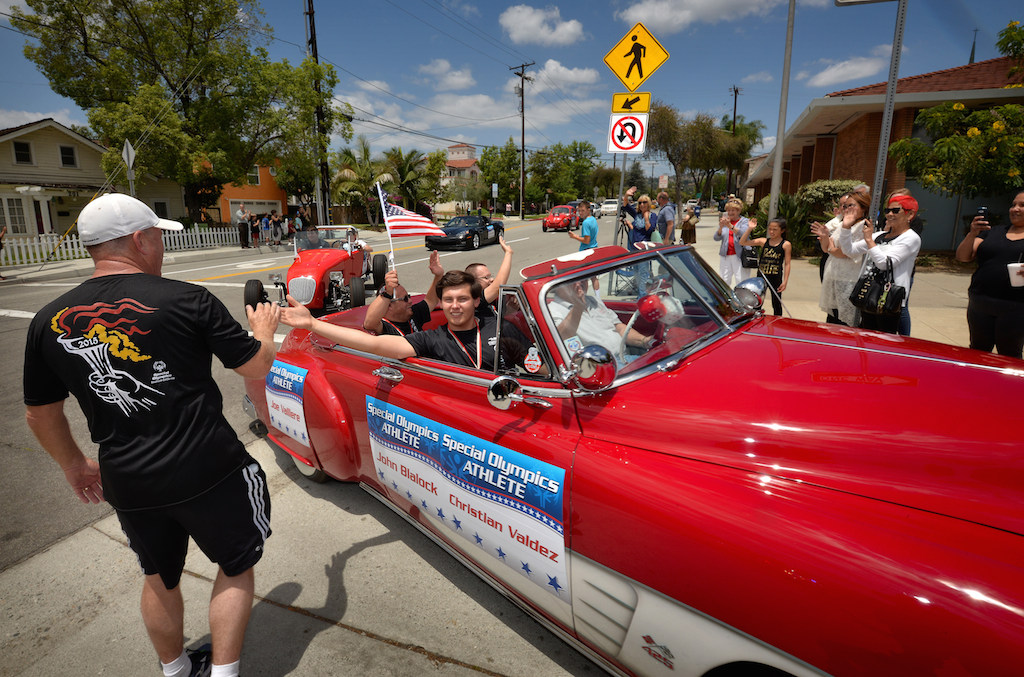 One of the parade cars carrying Special Olympics Athletes John Blalock and Christian Valdez enters the La Habra Police Department at the conclusion of Saturdays Law Enforcement Torch Run for Special Olympics. Photo by Steven Georges/Behind the Badge OC