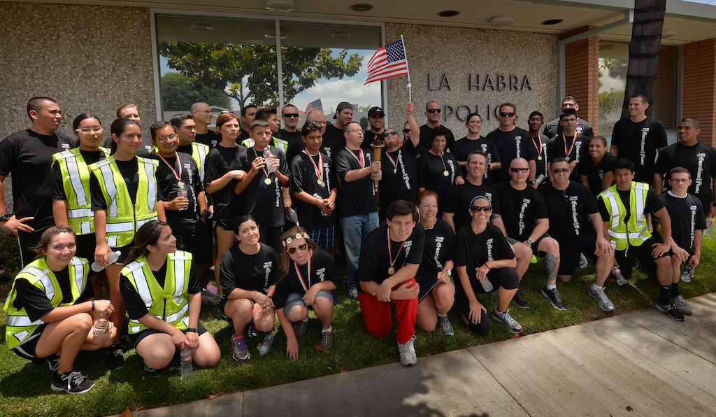 The La Habra PD team gathers in front of the La Habra Police Department at the conclusion of Saturdays Law Enforcement Torch Run for Special Olympics. Photo by Steven Georges/Behind the Badge OC