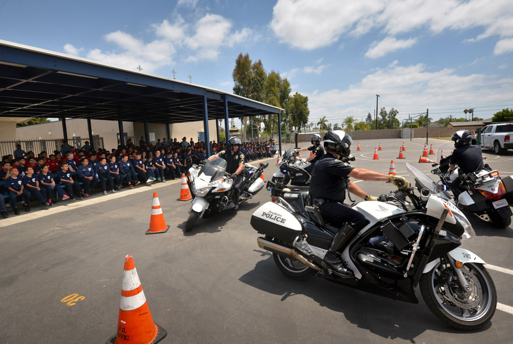 Anaheim Police give a motorcycle demonstration for junior cadets during Anaheim PD Cops 4 Kids Jr. Cadet Academy at Betsy Ross Elementary. Photo by Steven Georges/Behind the Badge OC