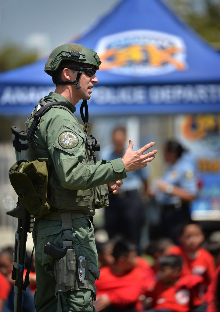 Anaheim SWAT Officer Kevin Voorhis talks to junior cadets during a SWAT demonstration for Anaheim PD Cops 4 Kids Jr. Cadet Academy at Betsy Ross Elementary. Photo by Steven Georges/Behind the Badge OC