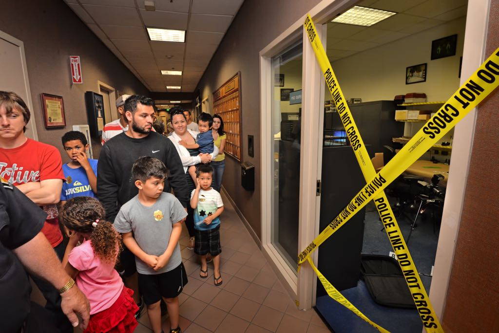 People taking a tour of Tustin Police Department headquarters walk by a crime lab display during Tustin PD’s 19th Annual Open House. Photo by Steven Georges/Behind the Badge OC
