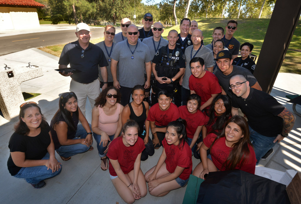 Fullerton police officers, back row, after receiving than you awards from Fullerton’s St. Philip Benizi Catholic Church’s Benizi Youth Leadership Team (BYLT) and Nonprofit Community Service Programs’ (CSP) Project PATH (Positive Action Toward Health) during the P2: Picnic with the Police event at Ted Craig Regional Park in Fullerton. Photo by Steven Georges/Behind the Badge OC