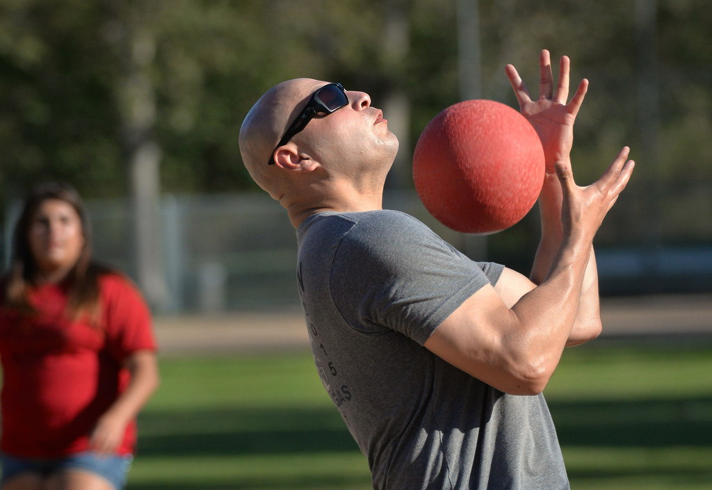 Fullerton Det. Luis Garcia catches a fly ball for an out during the P2: Picnic with the Police kickball game at Ted Craig Regional Park in Fullerton. Photo by Steven Georges/Behind the Badge OC