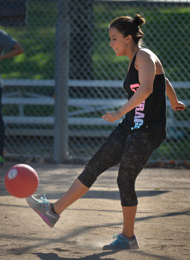 Natalia Giraud of FullertonÕs St. Philip Benizi Catholic ChurchÕs Benizi Youth Leadership Team (BYLT), kicks the ball during her turn at bat, er, ball, during the P2: Picnic with the Police kickball game at Ted Craig Regional Park in Fullerton. Photo by Steven Georges/Behind the Badge OC