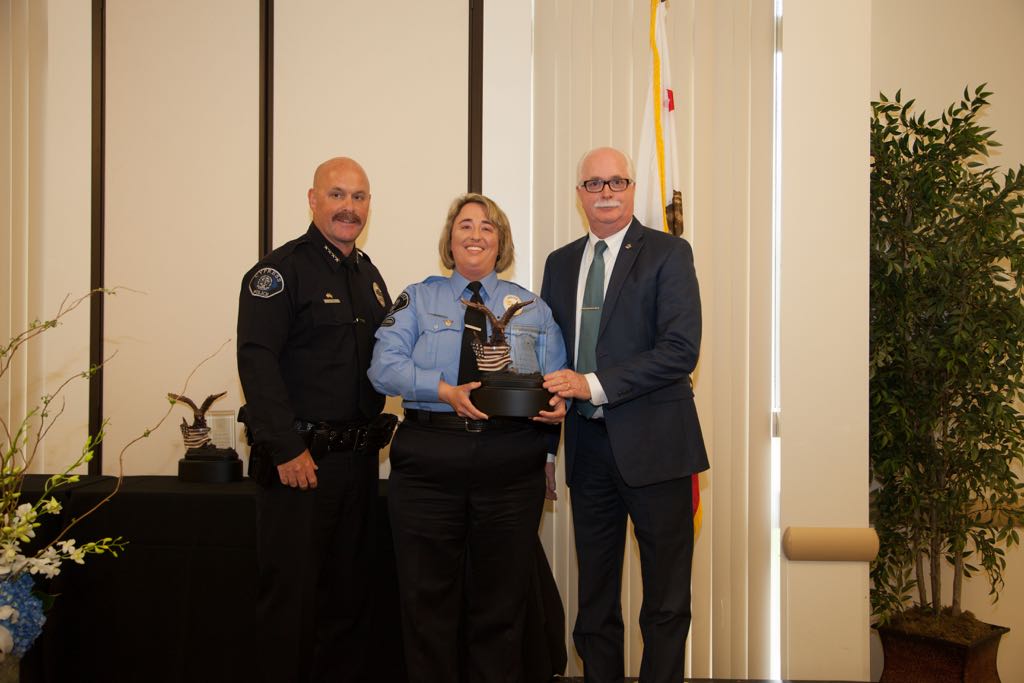 Police Chief Rodney Cox and President of the Cypress Police Foundation David Macdonlan present Brenda Perkily with the 2014 Citizen of the Year Award. Photo courtesy Cypress PD. 