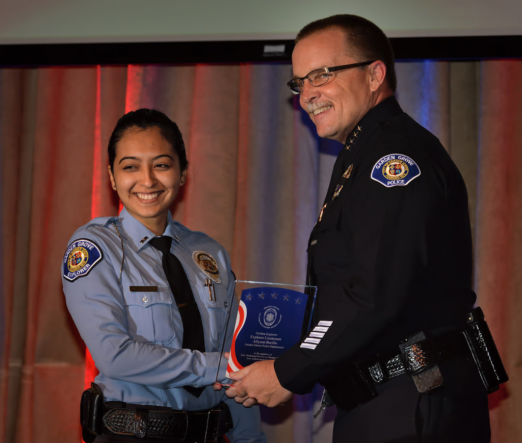 Garden Grove PD Explorer Lieutenant Allyson Burillo receives the Golden Explorer Award from Police Chief Todd Elgin during the 2015 Orange County Law Enforcement Explorer Advisors Association Gold Awards Dinner. Photo by Steven Georges/Behind the Badge OC