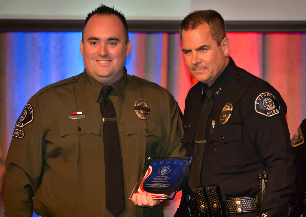 Police Service Officer Nate Regavado of the Cypress PD, left, receives the Golden Advisor Award during the 2015 Orange County Law Enforcement Explorer Advisors Association Gold Awards Dinner. Photo by Steven Georges/Behind the Badge OC