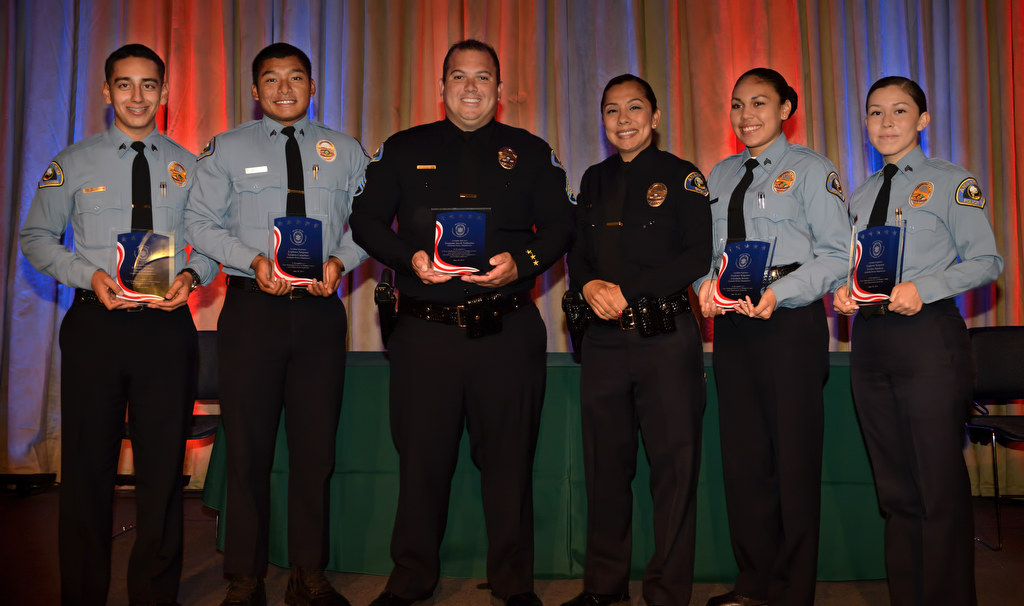 Award recipient Anaheim PD Sgt. Jacob Gallacher and his partner Officer Leslie Vargas, center, with Golden Explorer Award winners Sgt. Omar Gallardo, left, Sgt. Teodoro Carachure, Sgt. Estefania Acosta and Sgt. Evelyn Valencia at the conclusion of the 2015 Orange County Law Enforcement Explorer Advisors Association Gold Awards Dinner. Photo by Steven Georges/Behind the Badge OC