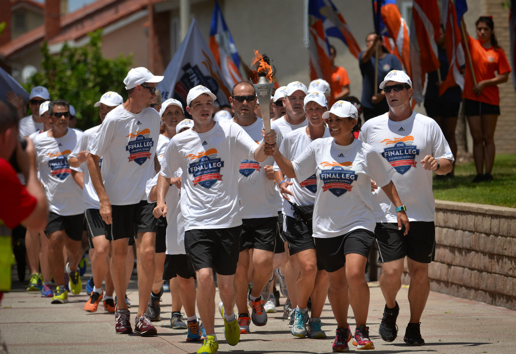 Runners from the Law Enforcement Torch Run Final Leg for Special Olympics arrive at the Cypress Civic Center. Photo by Steven Georges/Behind the Badge OC