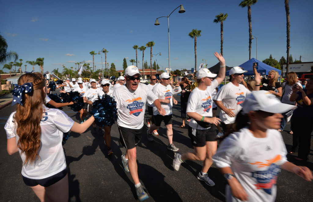 Runners from the Law Enforcement Torch Run Final Leg for Special Olympics arrive at the La Habra Community Center. Photo by Steven Georges/Behind the Badge OC