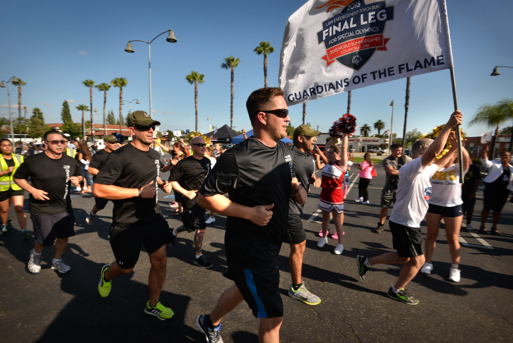 Runners from the La Habra Police Department arrive at the La Habra Community Center after running with the torch for the Law Enforcement Torch Run Final Leg for Special Olympics. Photo by Steven Georges/Behind the Badge OC