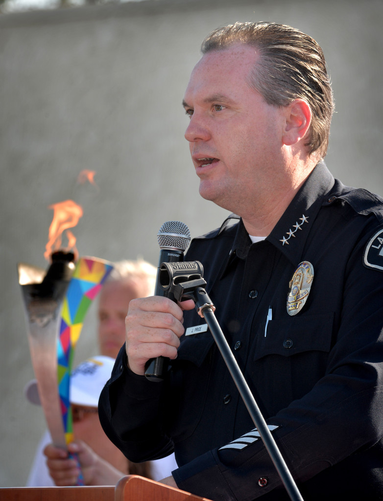 La Habra Police Chief Jerry Price welcomes the runners from the Law Enforcement Torch Run Final Leg for Special Olympics during a ceremony at the La Habra Community Center. Photo by Steven Georges/Behind the Badge OC