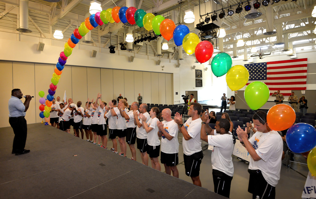 Special Olympic Athlete Jay White sings What a Wonderful World on stage at the Orange County Sheriff Training Academy in Tustin during a torch run ceremony hosted by the Tustin PD. Photo by Steven Georges/Behind the Badge OC