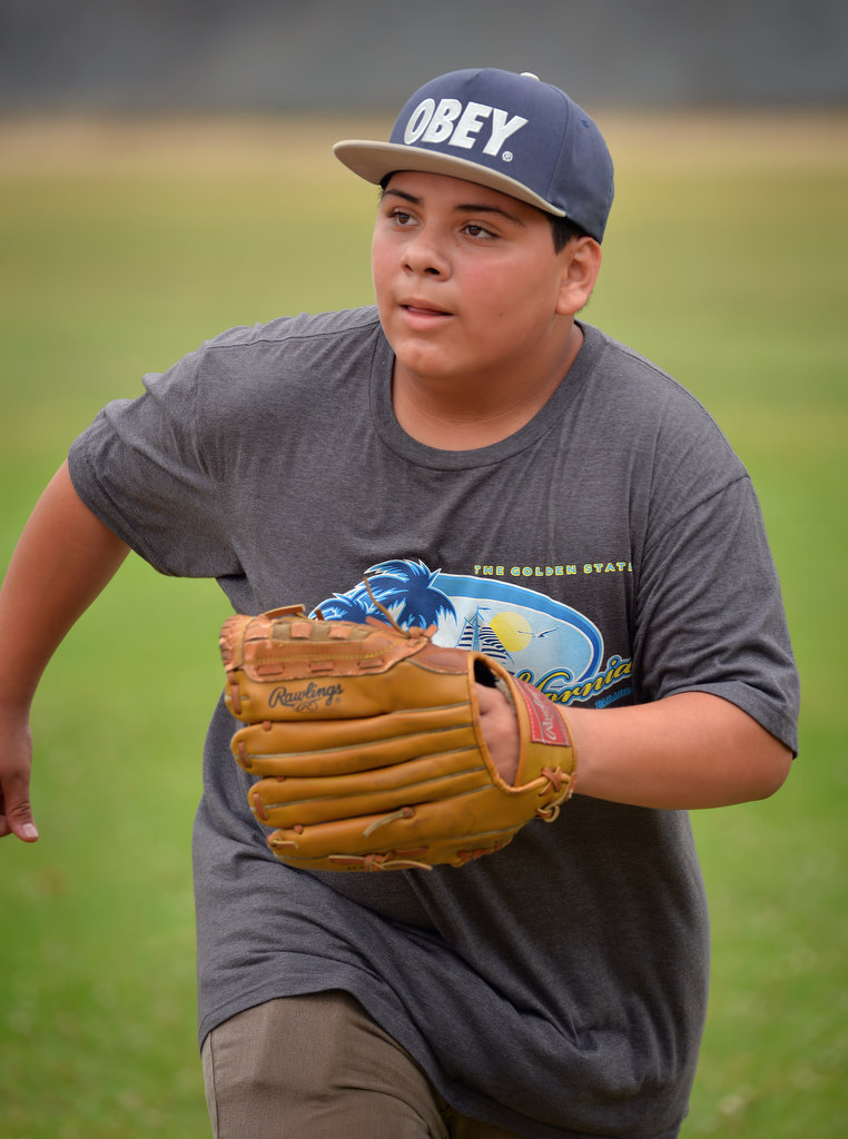 Elijah Ornelas, 12, participates on a baseball camp for at-risk kids at "The YardÓ in Fullerton. Photo by Steven Georges/Behind the Badge OC